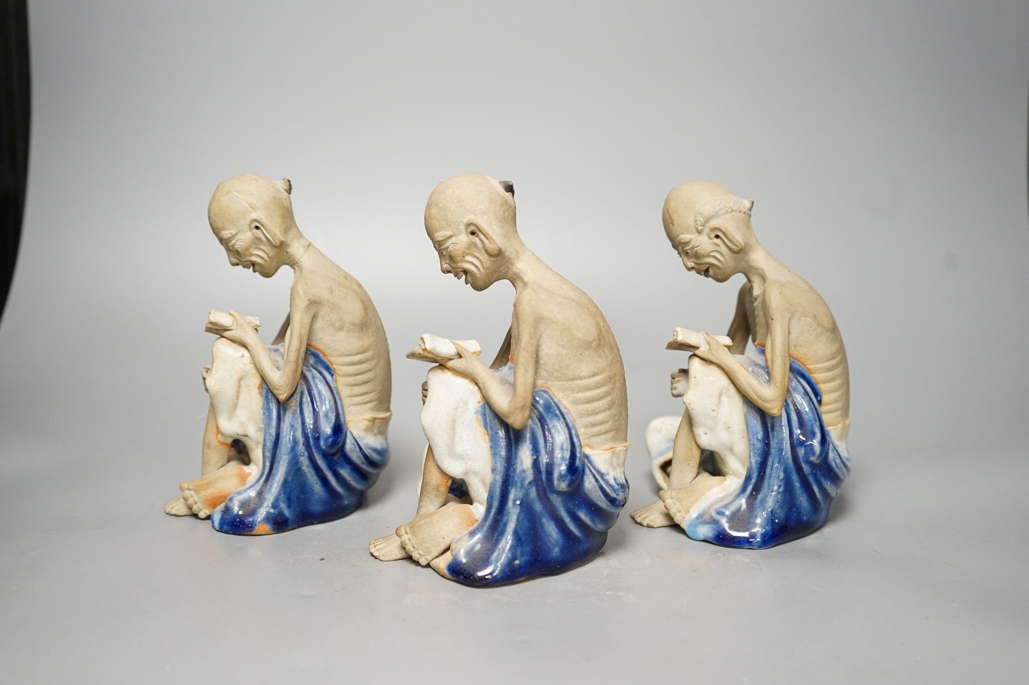 A set of three Shiwan pottery figures of Inohan, 17cm